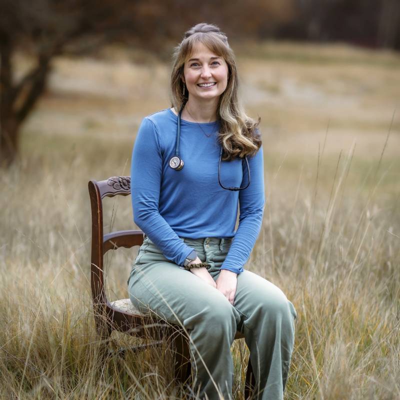 Doctor sitting in field